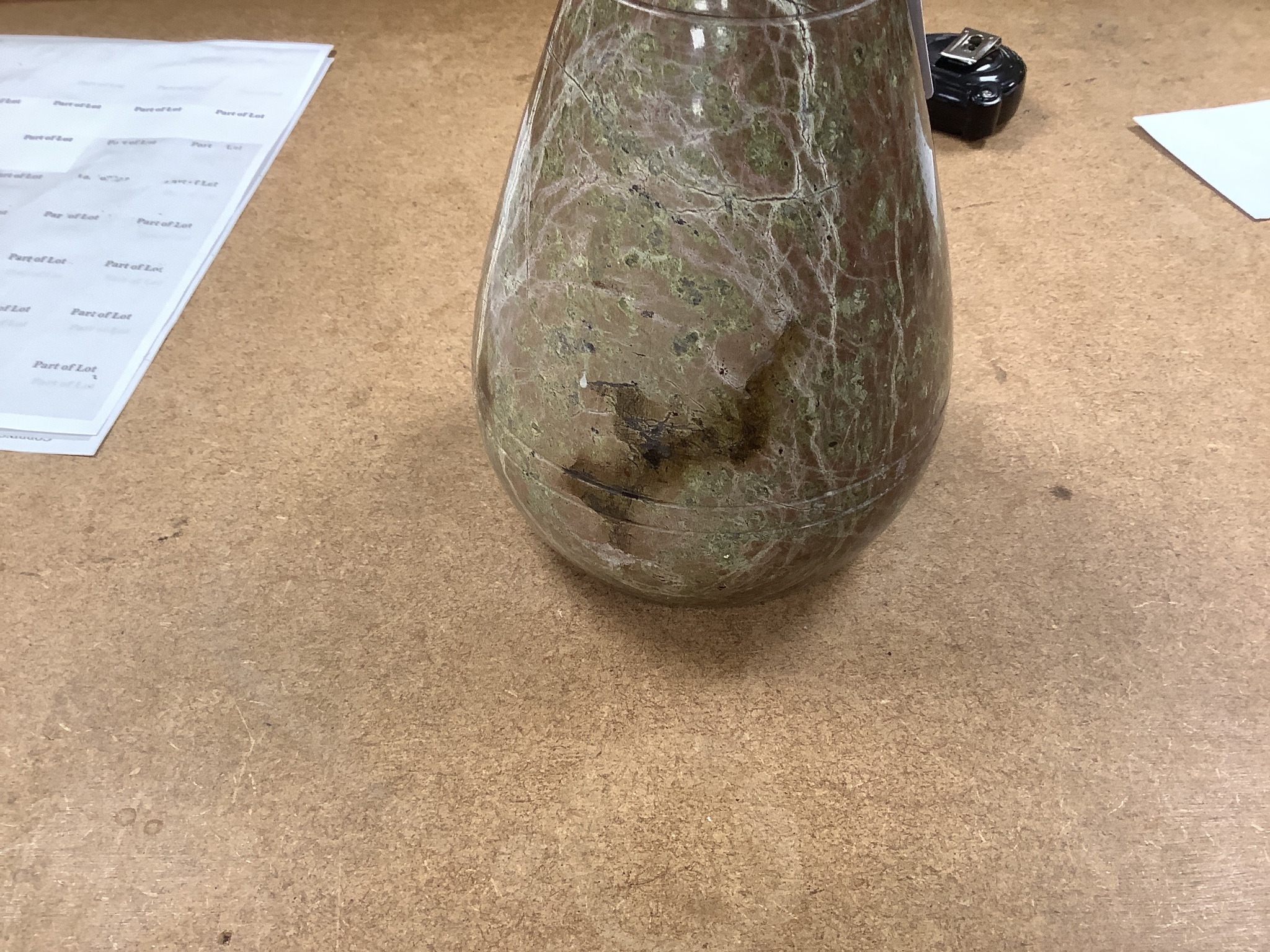A polished serpentine doorstop. 21cm tall